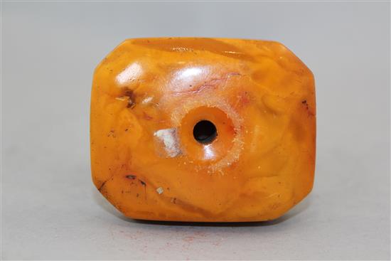A Chinese egg yolk yellow amber figure of He Xiangu, 20th century, 14cm, glued repairs